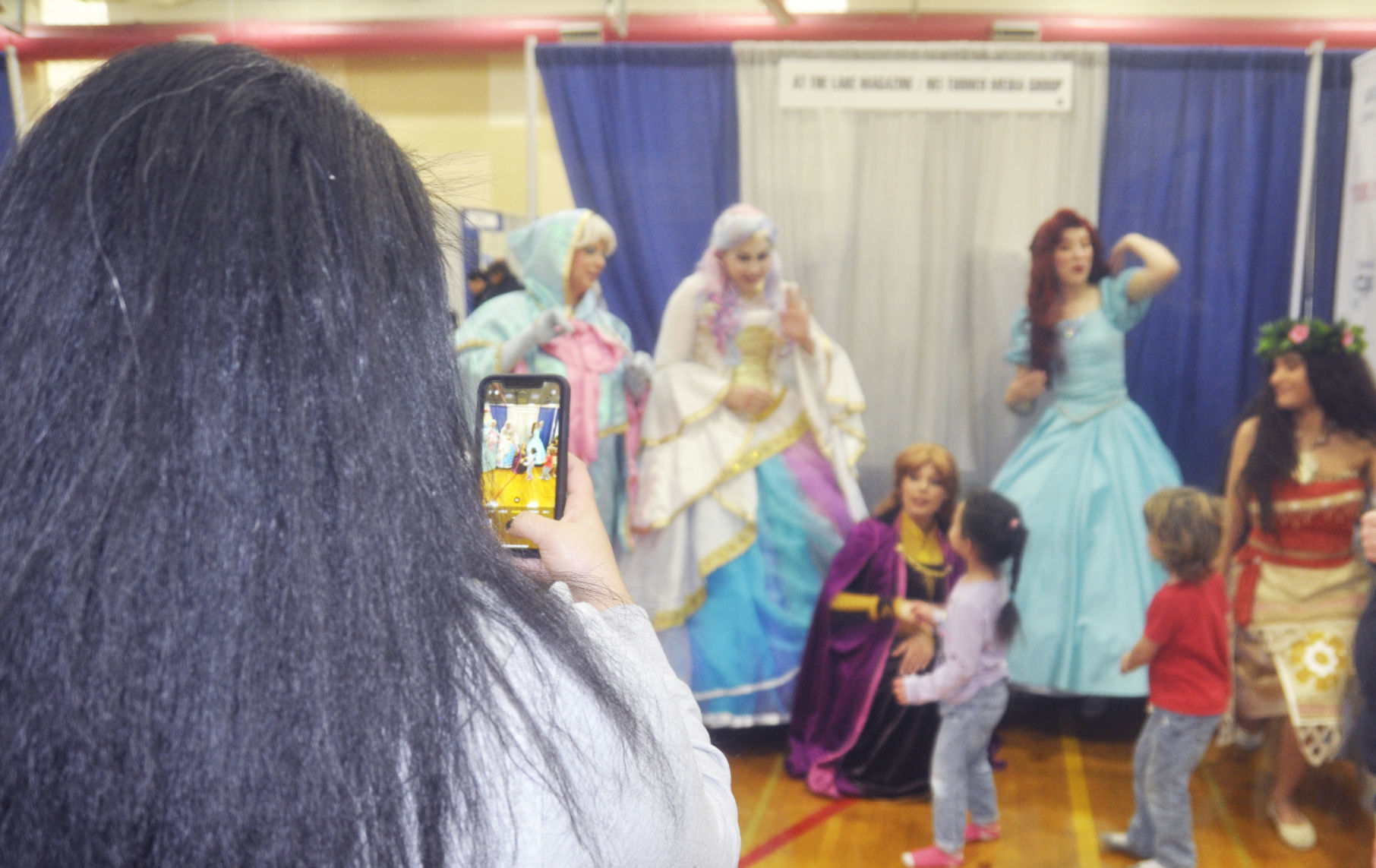 Kids Expo - cellphone pic with princesses